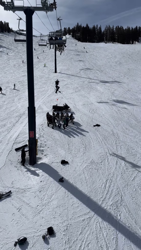 Terrifying moment teen snowboarder slams onto ground after dangling high in air from ski lift