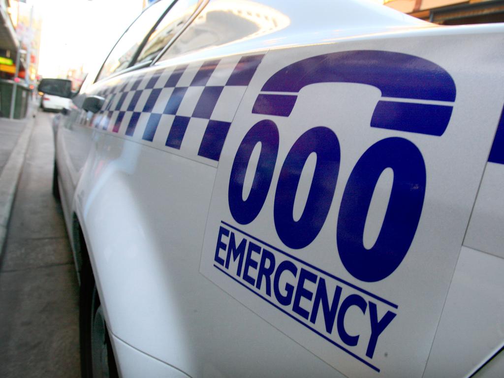 Car on roof after crash on busy eastern suburbs main road