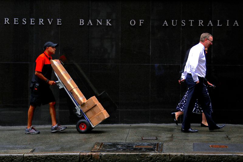 Australia’s central bank holds rates, warns of possible further hike