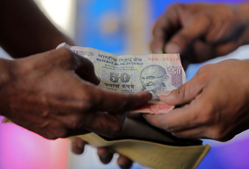 Indian rupee to gain slightly this year amid continued RBI intervention: Reuters poll