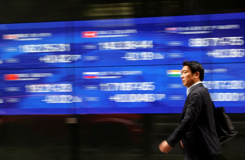 Asian shares track Wall Street higher; China deflation risks persist