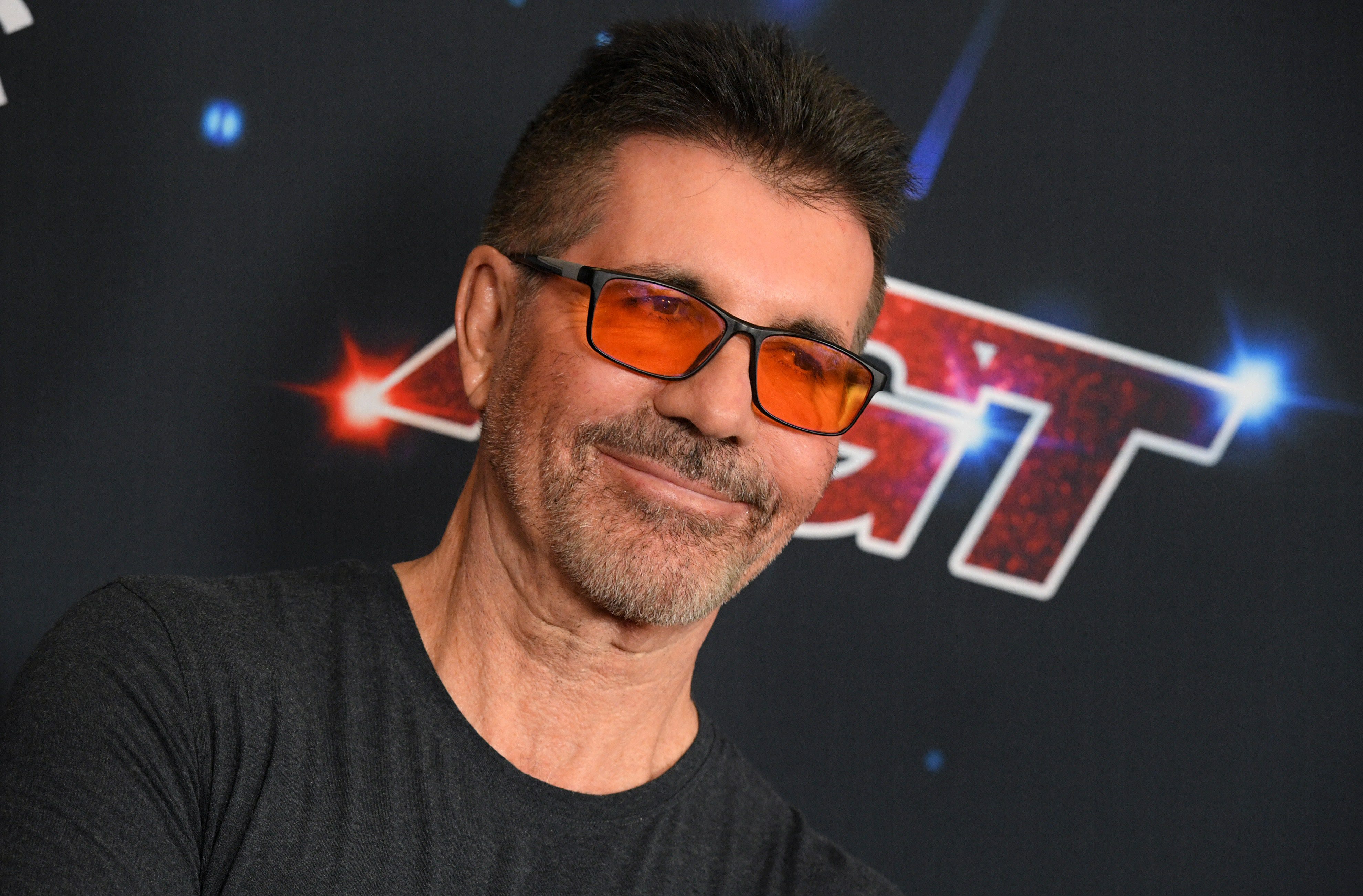 Simon Cowell Wears Red-Tinted Glasses to Ease His Migraines—Do They Actually Work?