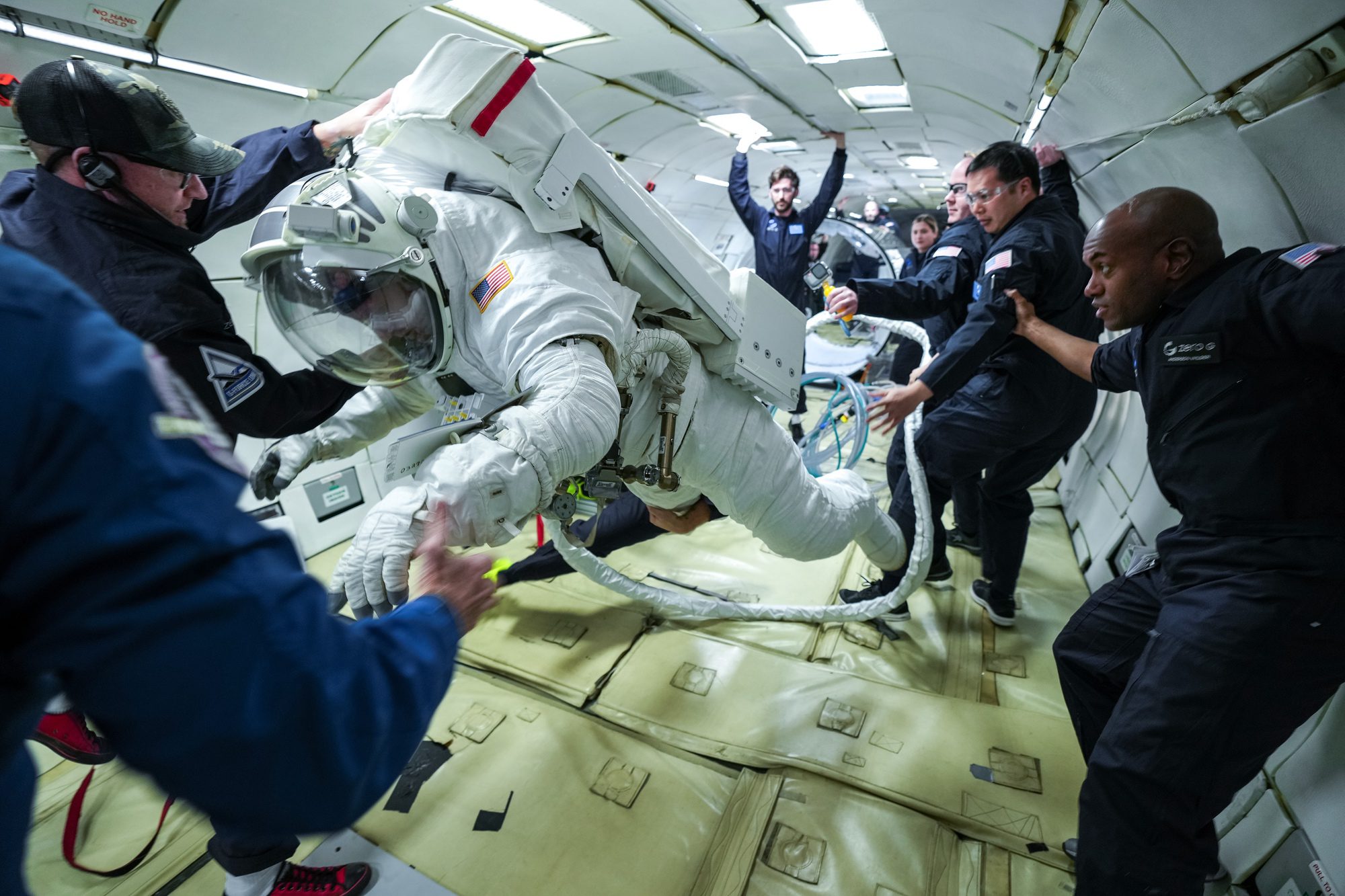 Collins performs tests of new space station spacesuit