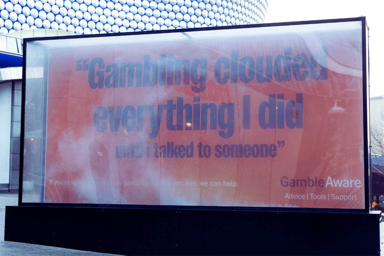 GambleAware billboard fills with smoke to show gambling ‘clouds’ vision