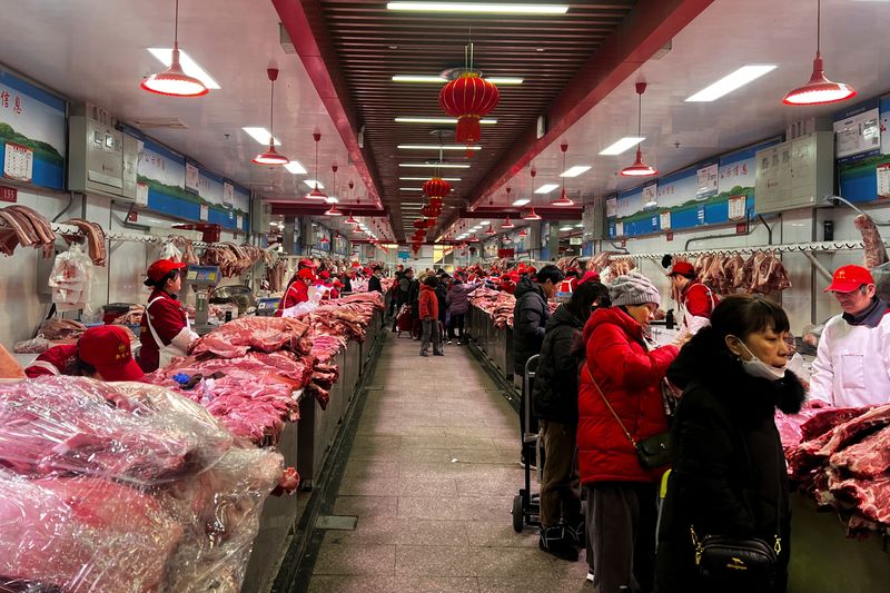 China’s consumer prices swing up on seasonal Lunar New Year gains