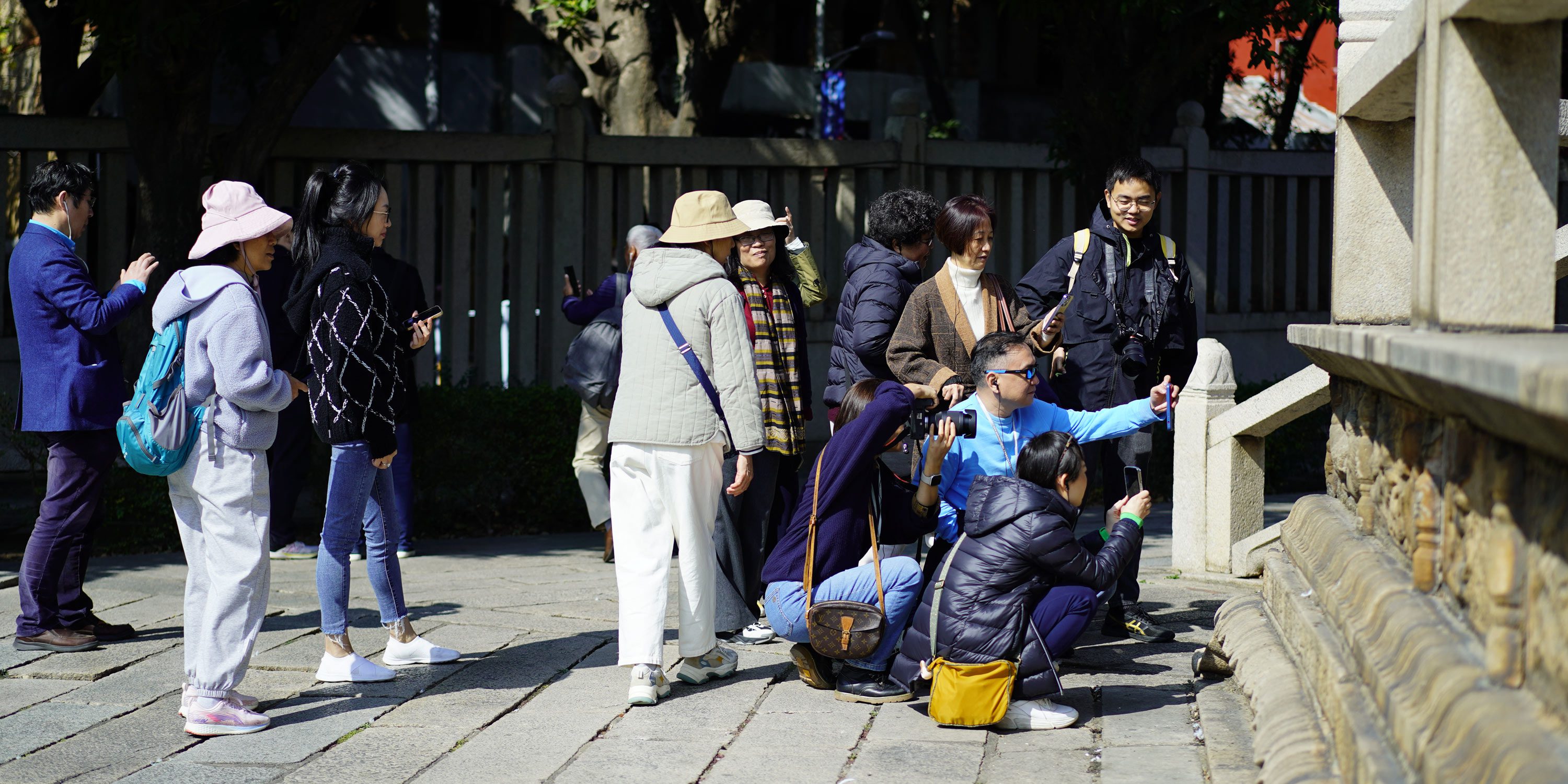 In China, the Hottest Travel Accessory Is a Tenured Professor