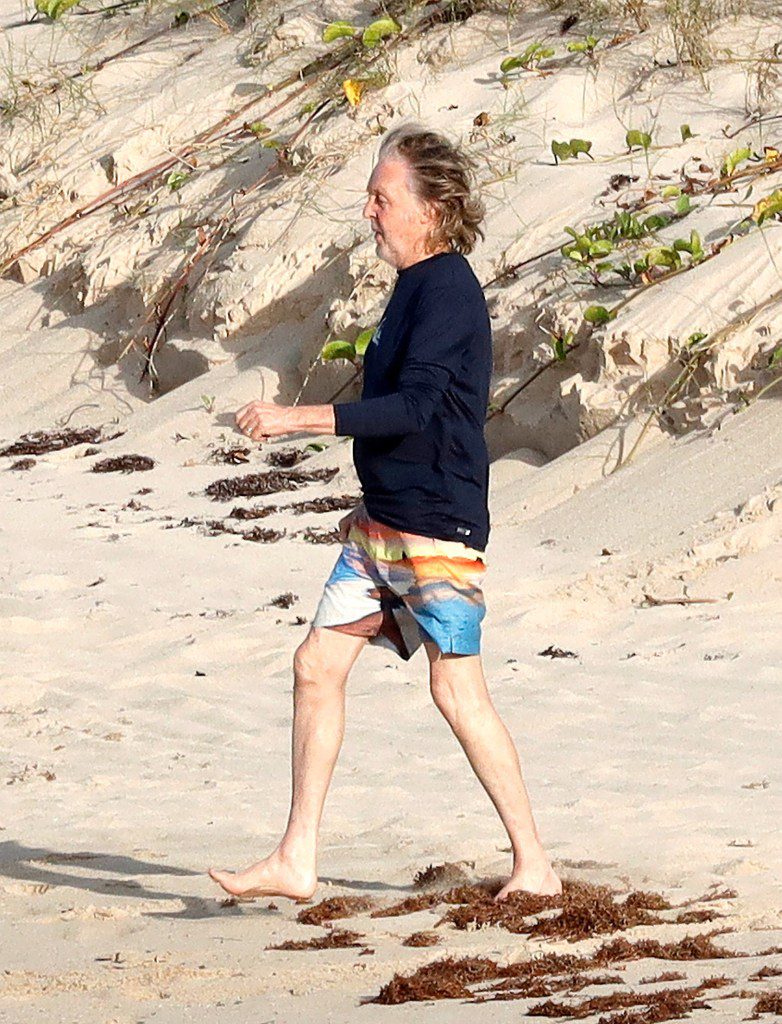 Paul McCartney, 81, and wife Nancy Shevell, 64, enjoy the ocean on beach vacation in St. Barts