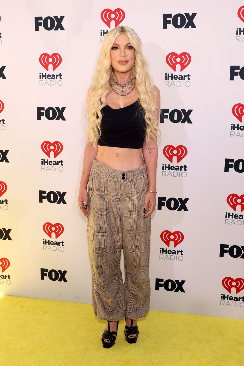 Tori Spelling wore daughter’s top and borrowed pants after iHeartRadio Music Awards ‘fashion emergency’