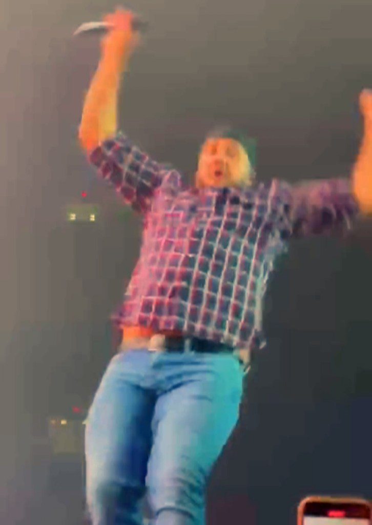 Luke Bryan falls on stage after slipping on fan’s cell phone: ‘My lawyer will be calling’