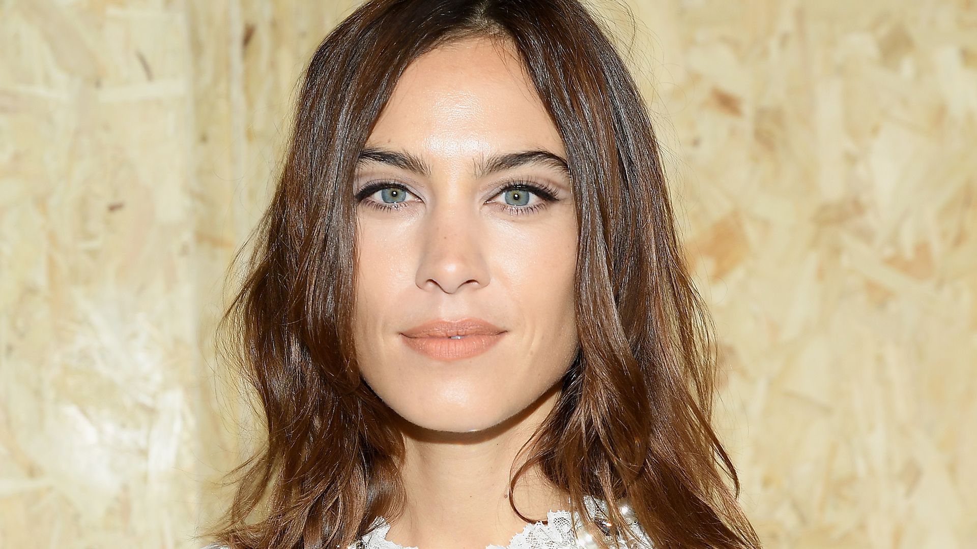 Alexa Chung’s sheer holiday dress is giving major sultry siren vibes