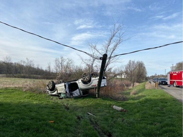 Driver escapes injury as crash brings power line down onto vehicle