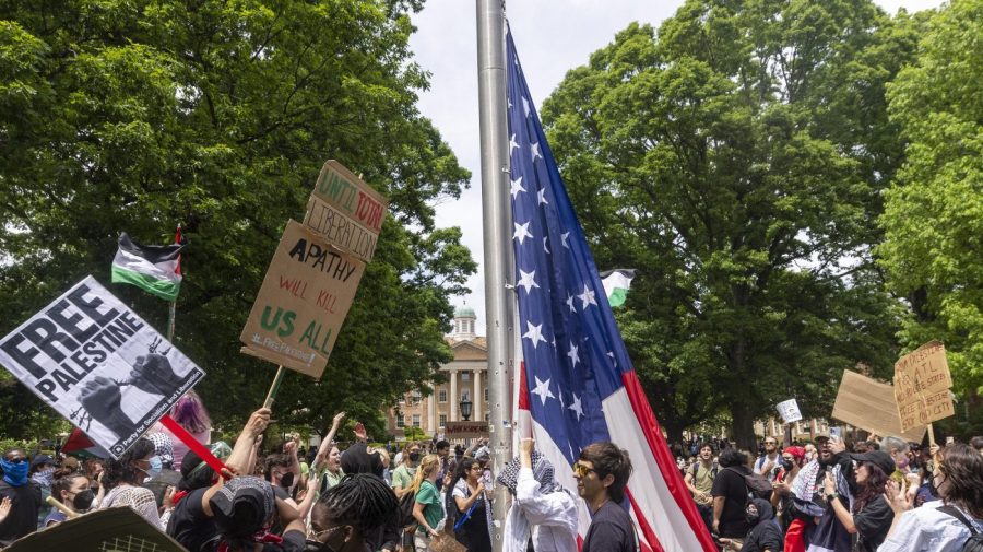 Trump posts campaign ad praising UNC students holding up US flag during campus protest