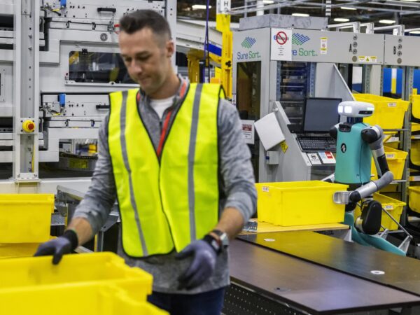 As Amazon’s robot ranks swell, workers worry about their future