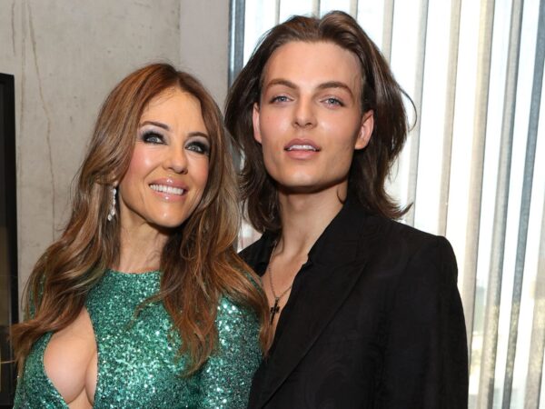 Elizabeth Hurley stuns in plunging emerald dress as she’s supported by son Damian