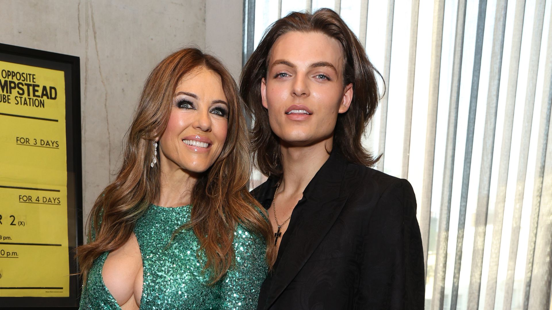 Elizabeth Hurley stuns in plunging emerald dress as she’s supported by son Damian