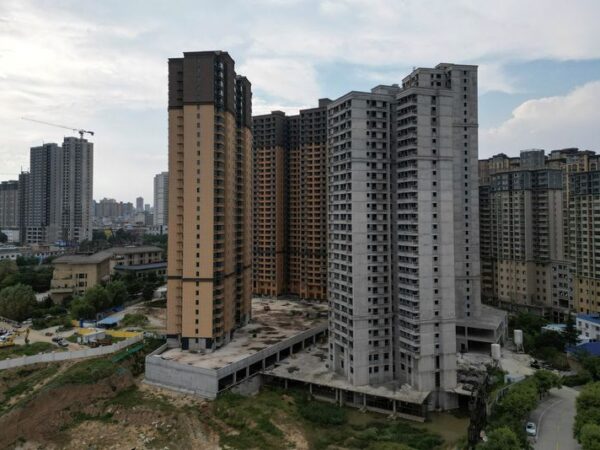 China’s new home prices inch up for 9th month in May, survey shows